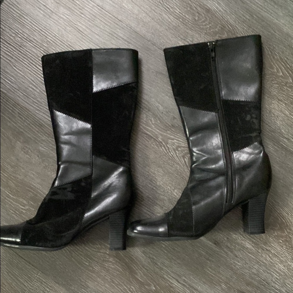 Women’s boots, black with a chunk heel. Very stylish size 8 1/2